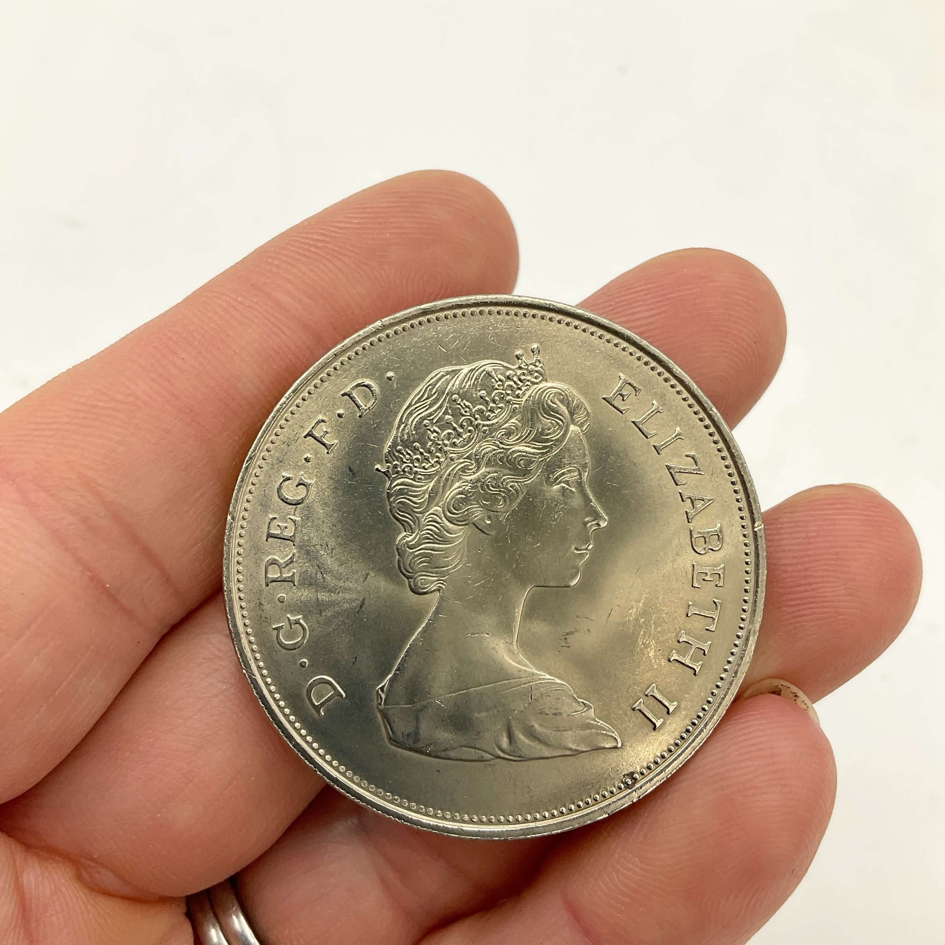 Charles and Diana 1981 Royal Wedding Coin held in a hand