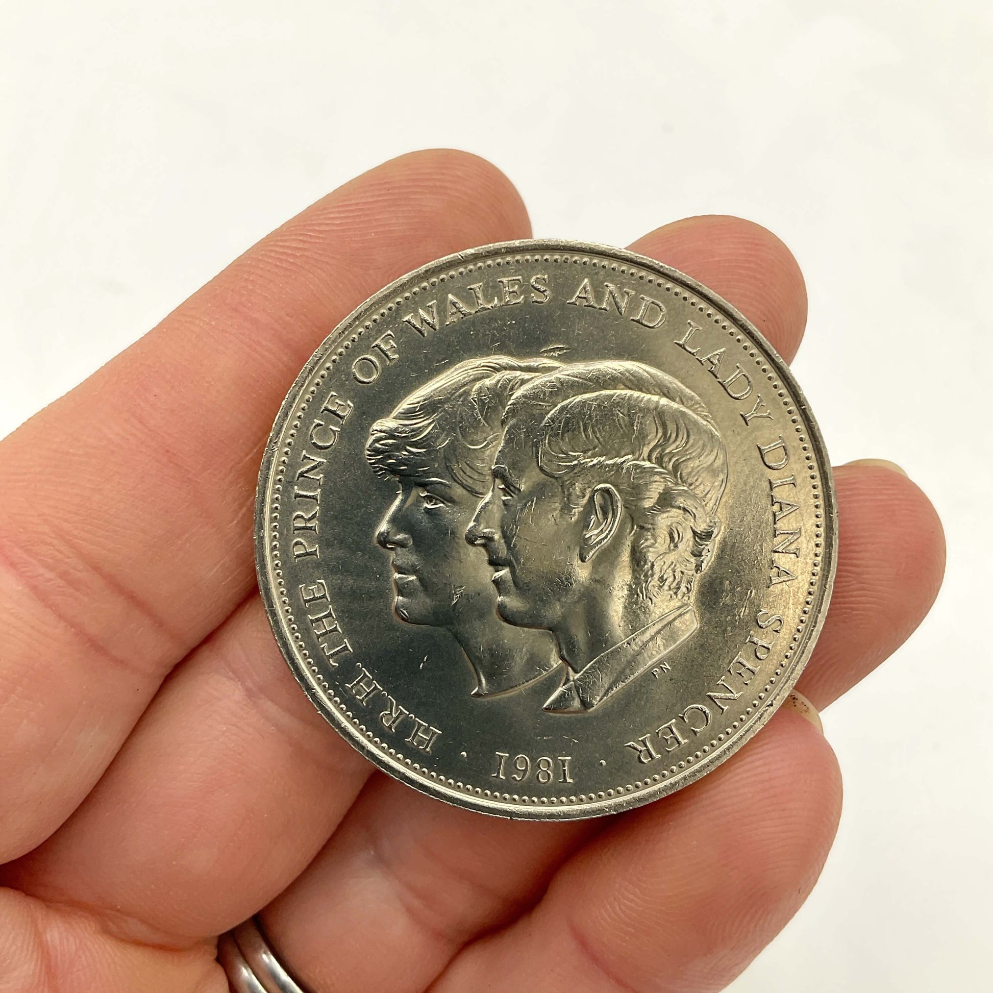 Charles and Diana 1981 Royal Wedding Coin held in a hand
