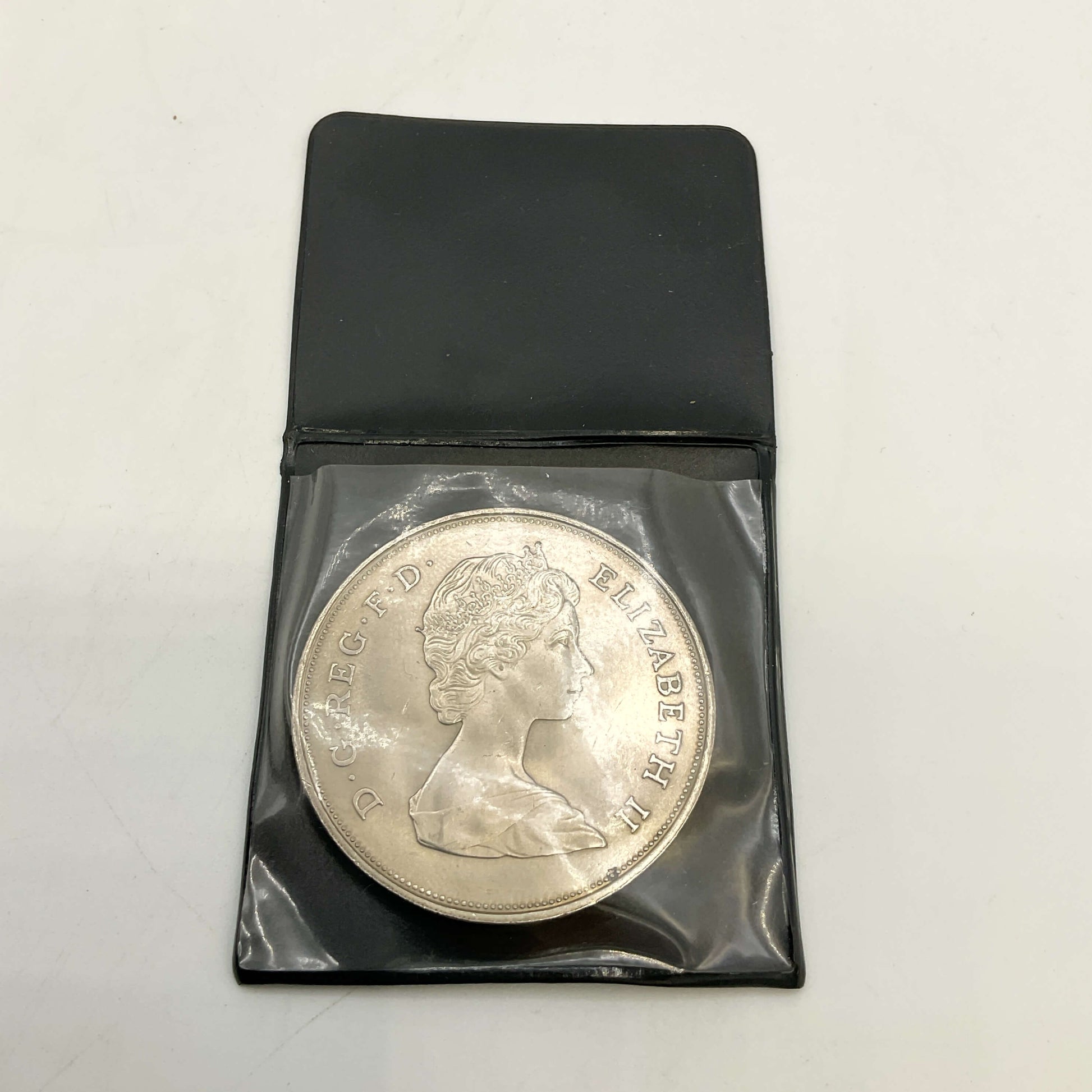 Charles and Diana 1981 Royal Wedding Coin in a black case on a white surface