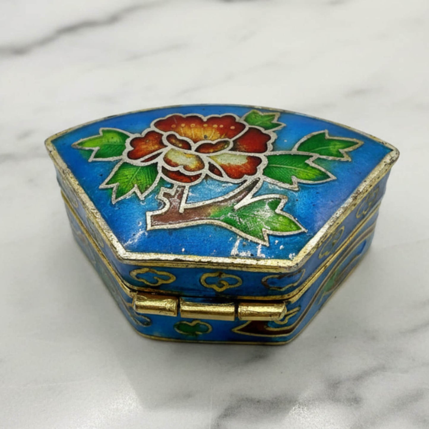 Chinese Cloisonné Enamel Pill Box on a marble surface