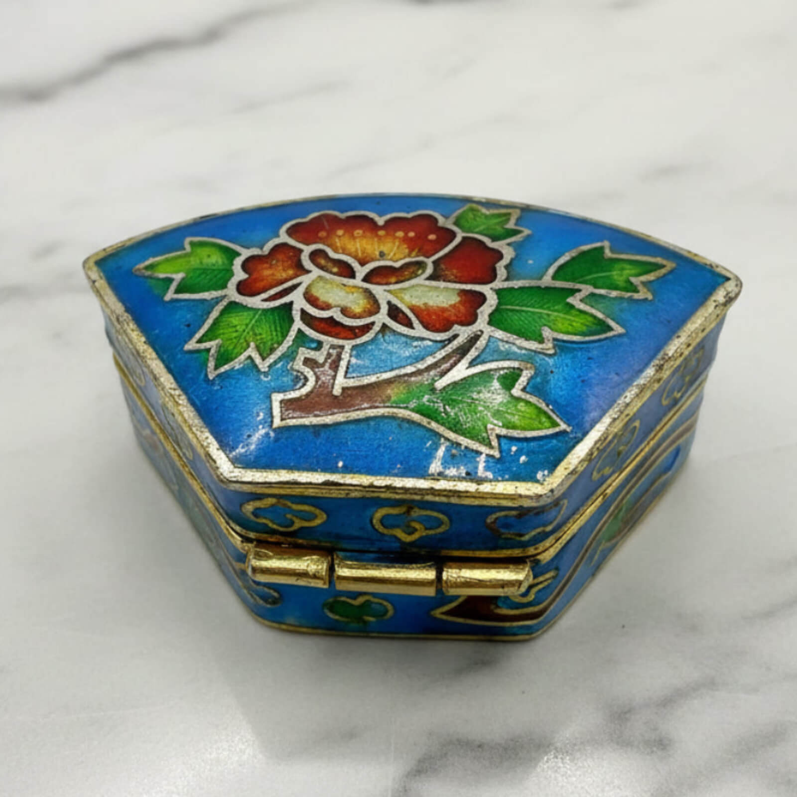 Chinese Cloisonné Enamel Pill Box on a marble surface