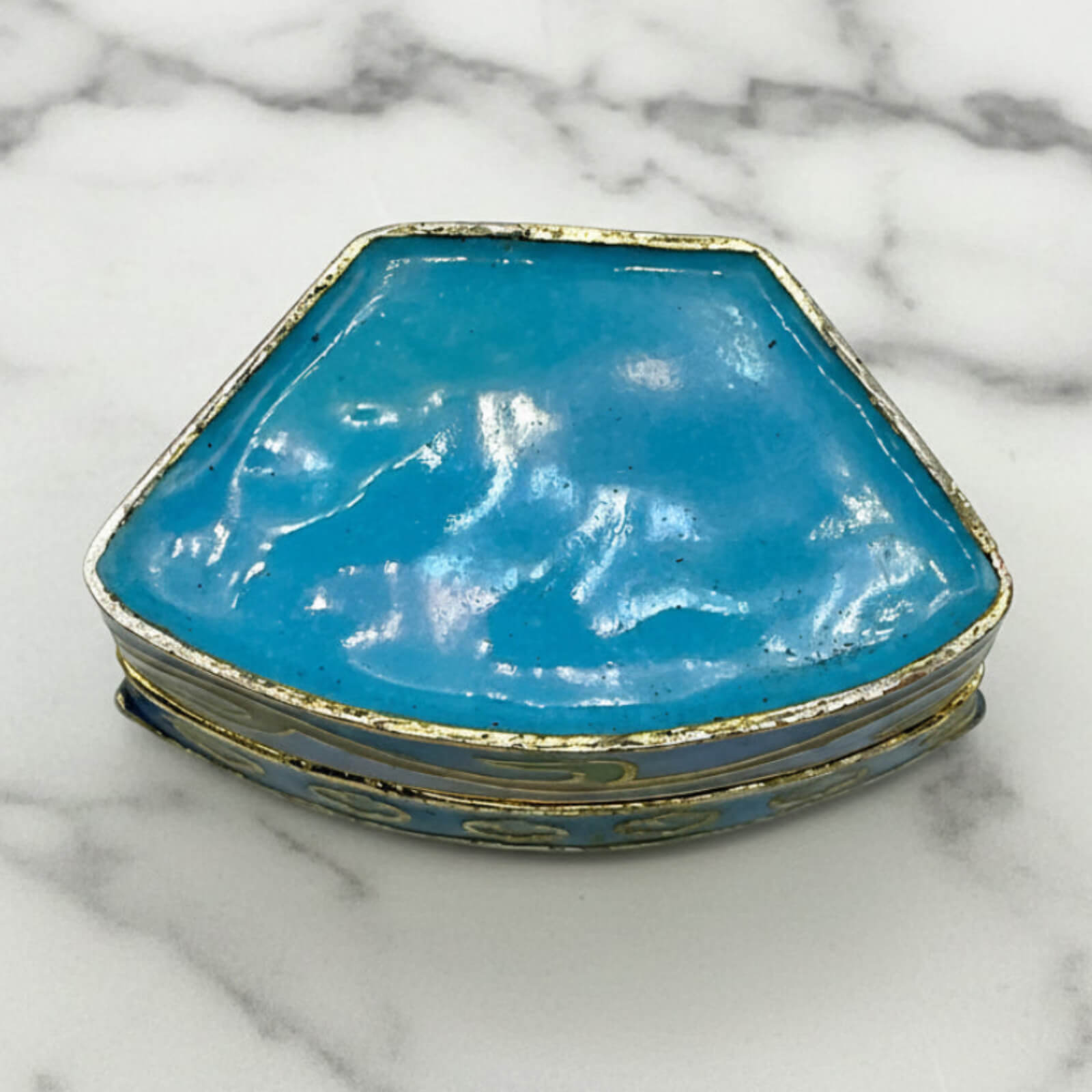Chinese Cloisonné Enamel Pill Box base on a marble surface