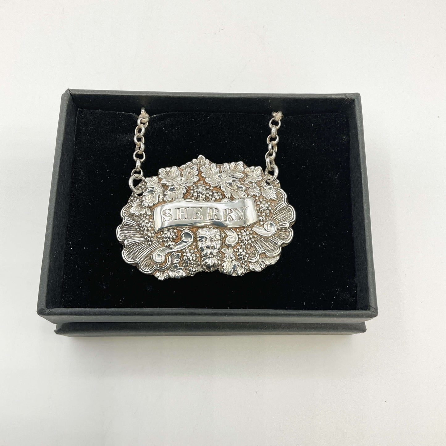 Silver Sherry decanter label black box on a white background