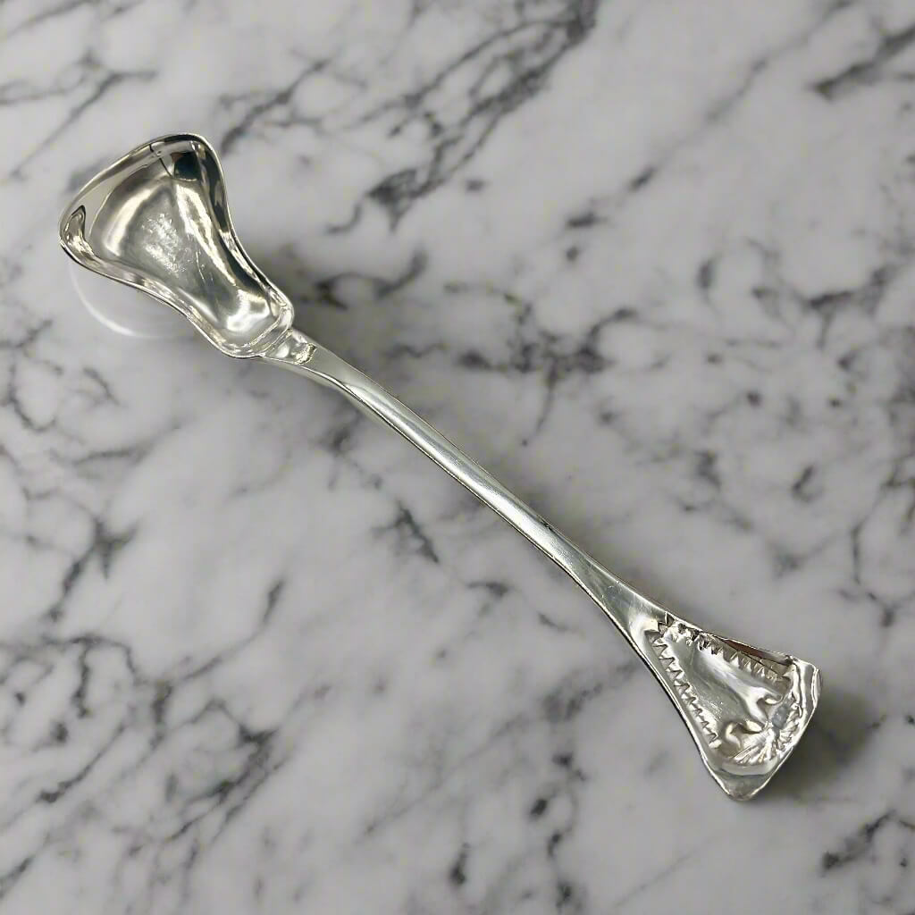 Silver spoon on a marble surface