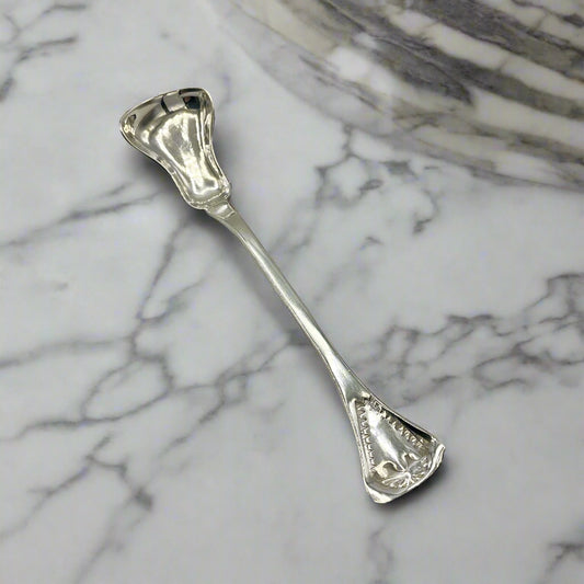 Silver spoon on a marble surface