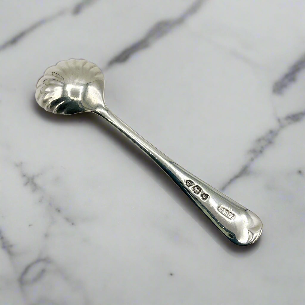 Silver spoon on a marble surface