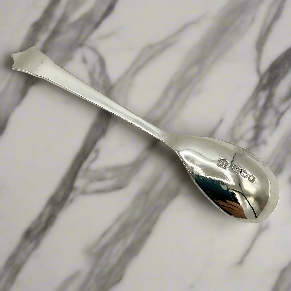 Silver spoon on a marble worktop