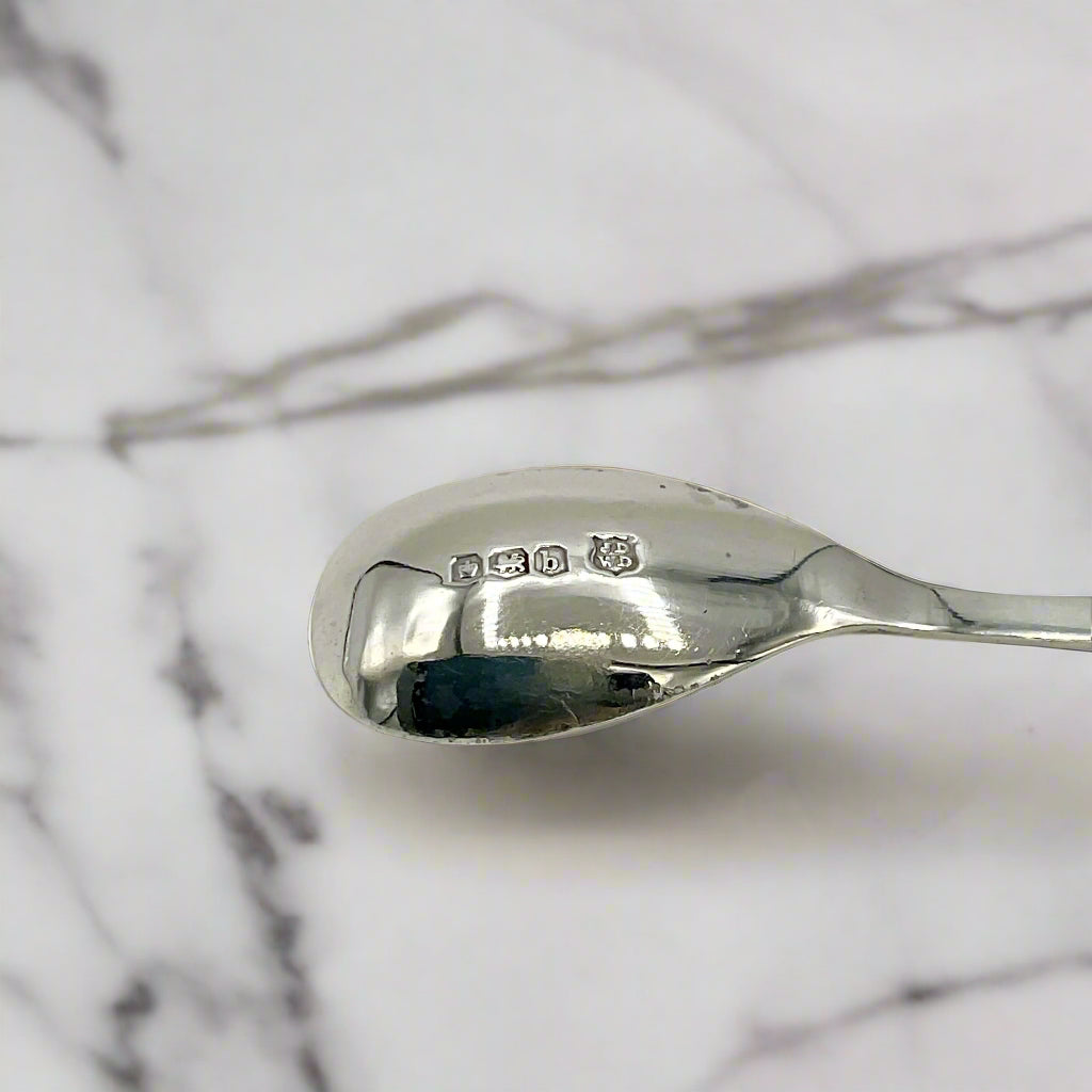 Silver spoon on a marble background