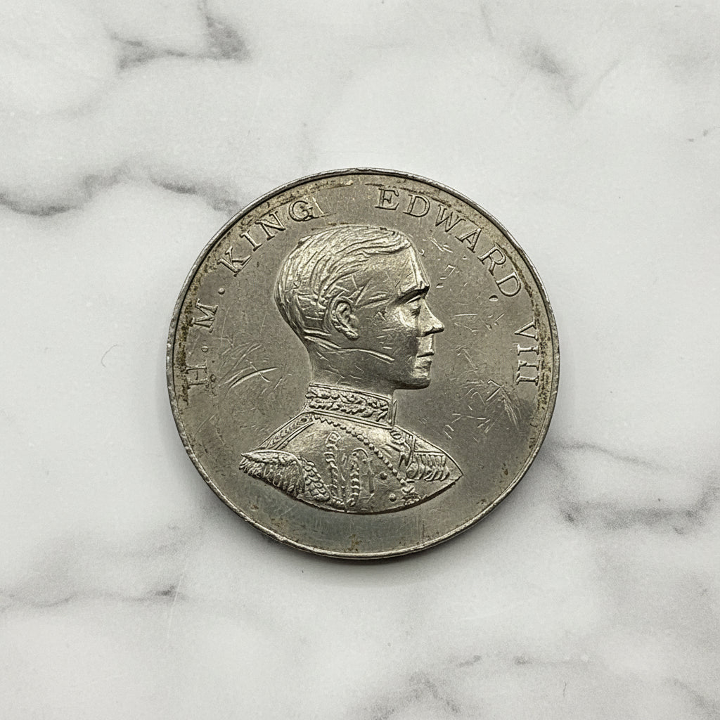 Silver medal with a portrait on a marble background