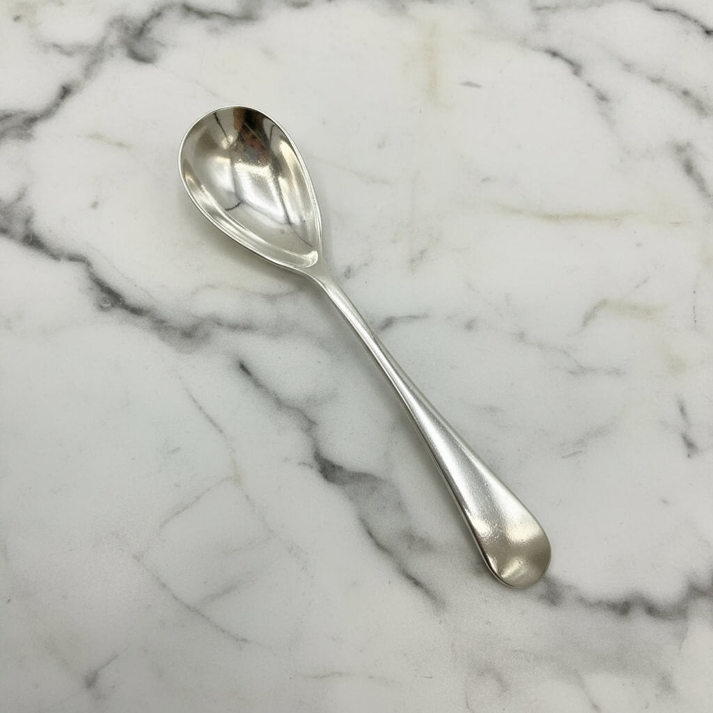 Silver spoon on a marble surface