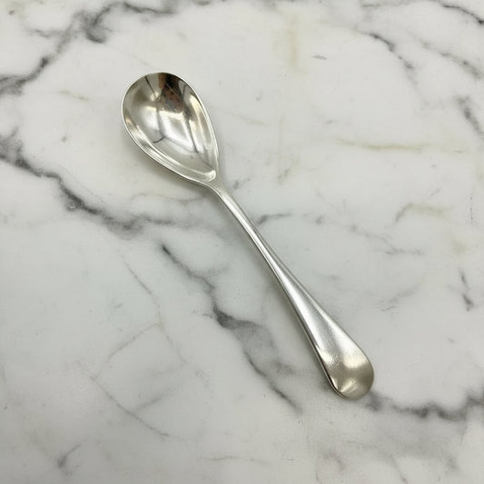 Silver spoon on a marble surface