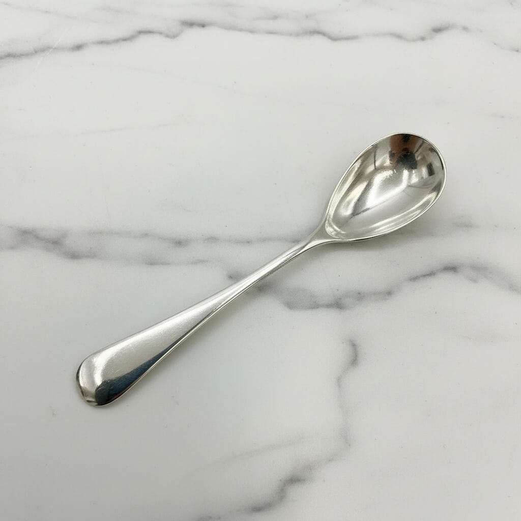 Silver spoon on a marble surface