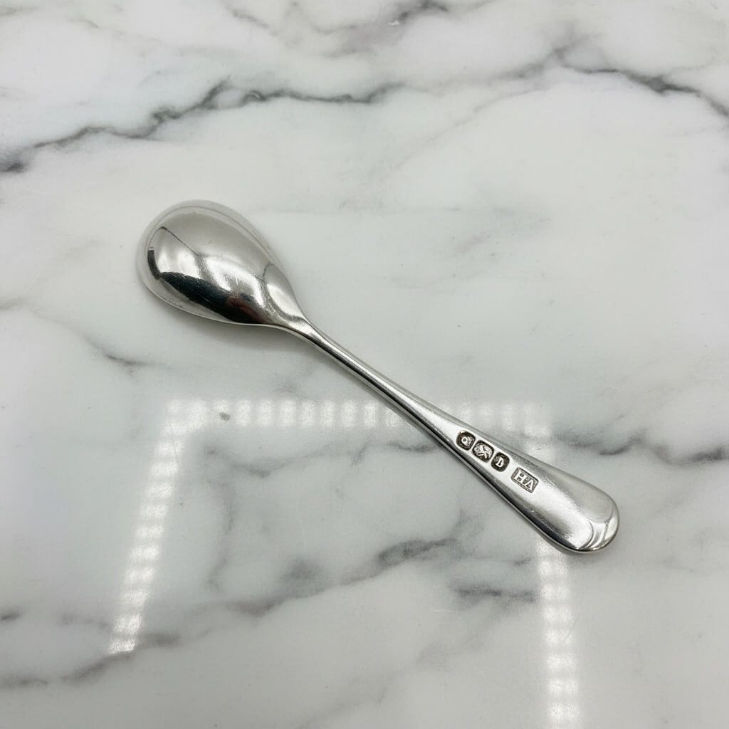 Silver spoon on a marble surface