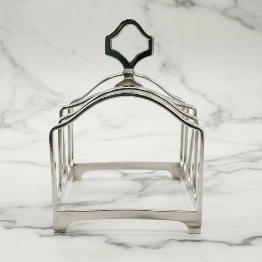 Side of silver toast rack on a marble background