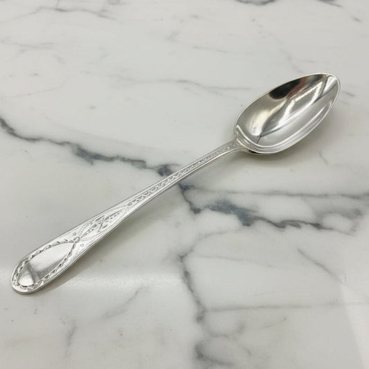 Silver spoon on a marble surface