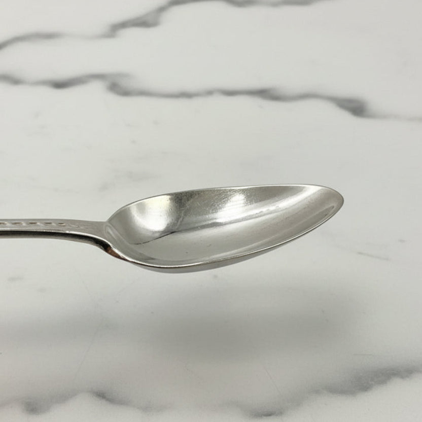 Silver spoon on a marble background 