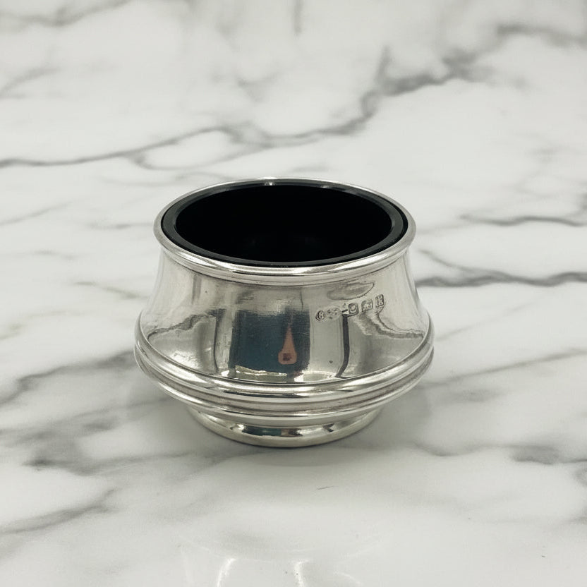 Silver salt with blue liner on marble background 