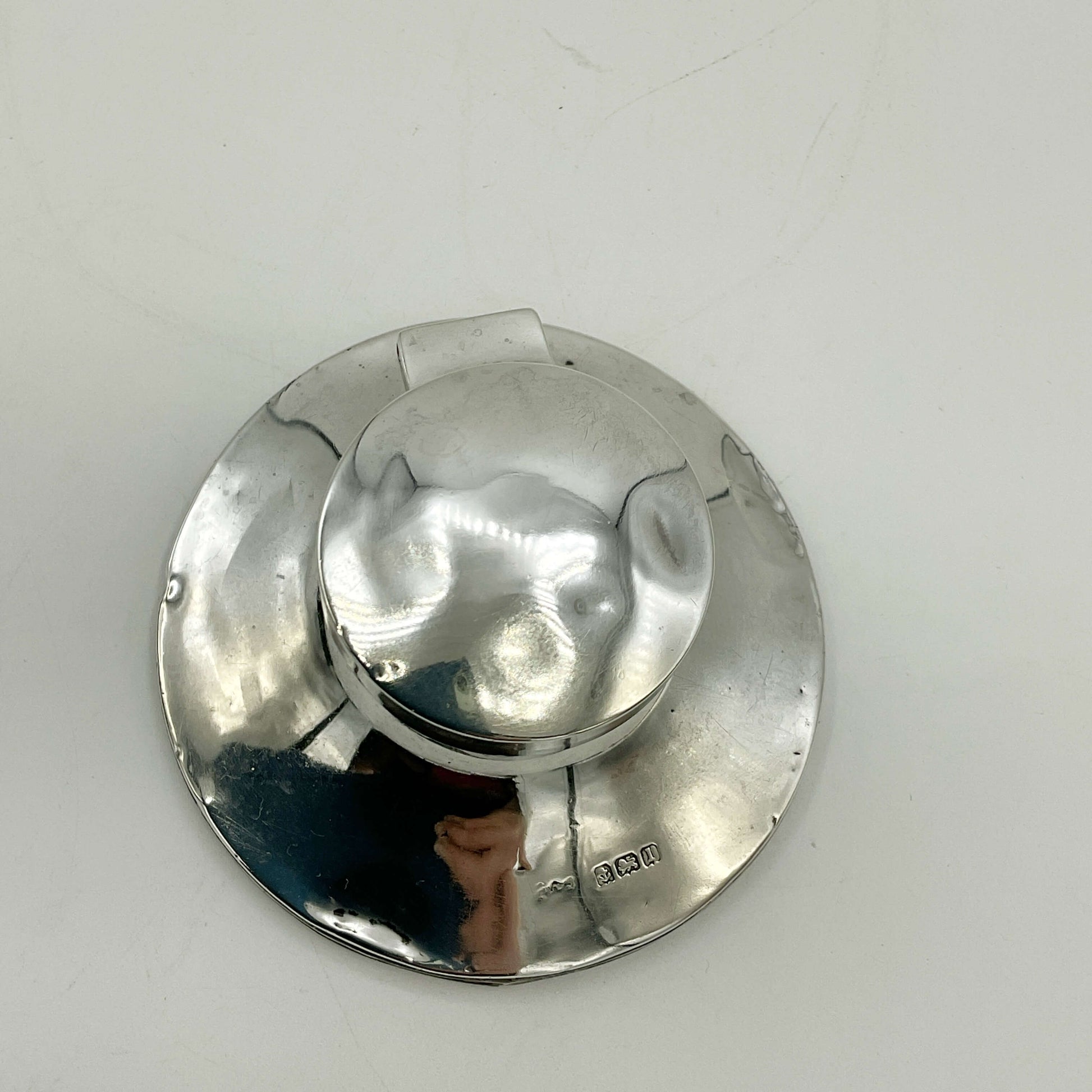 Antique small sterling silver inkwell with ornate design, vintage style, by Beeches Vintage, shown on a wooden surface.