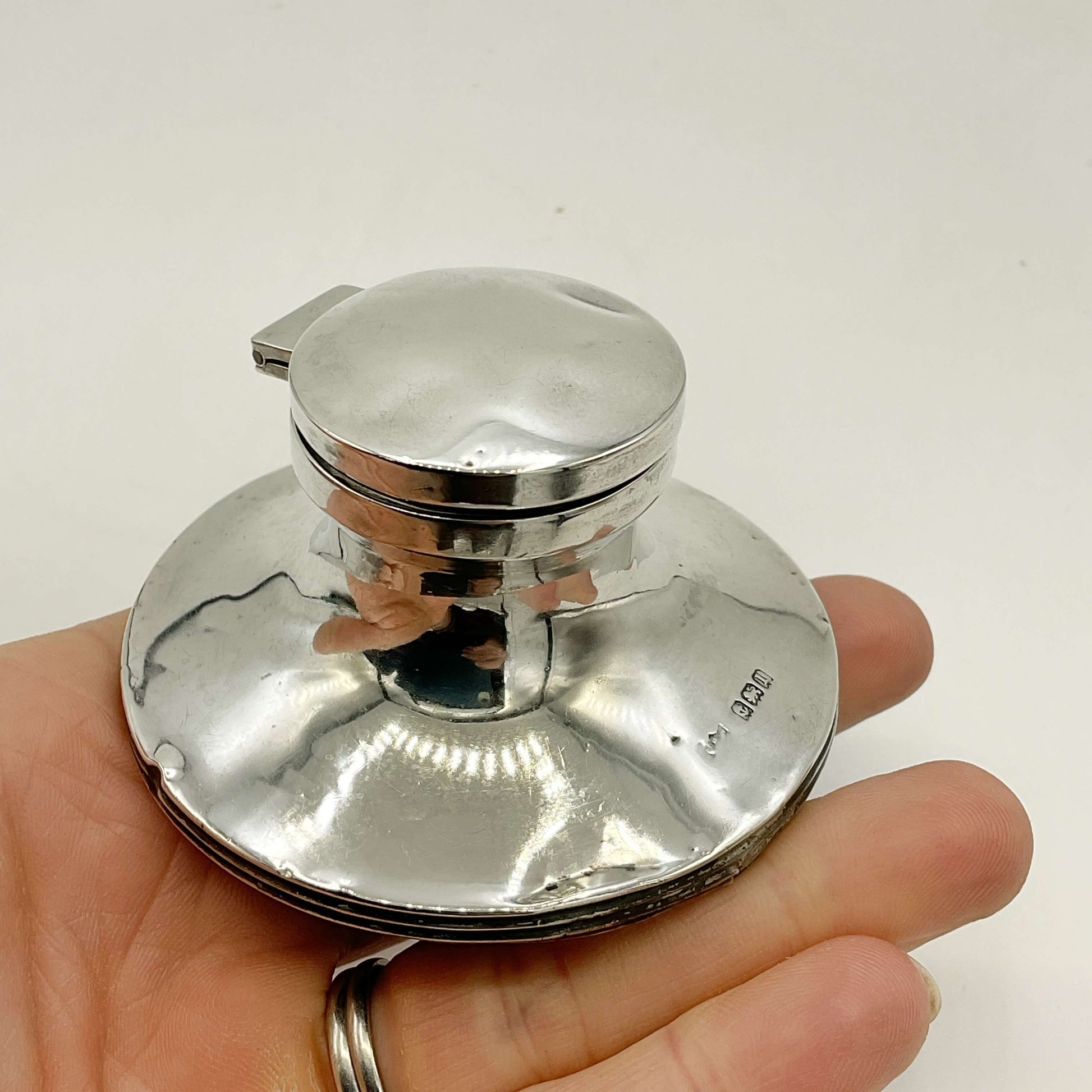 Small antique sterling silver inkwell by Beeches Vintage with ornate detailing, perfect for vintage desk decor.