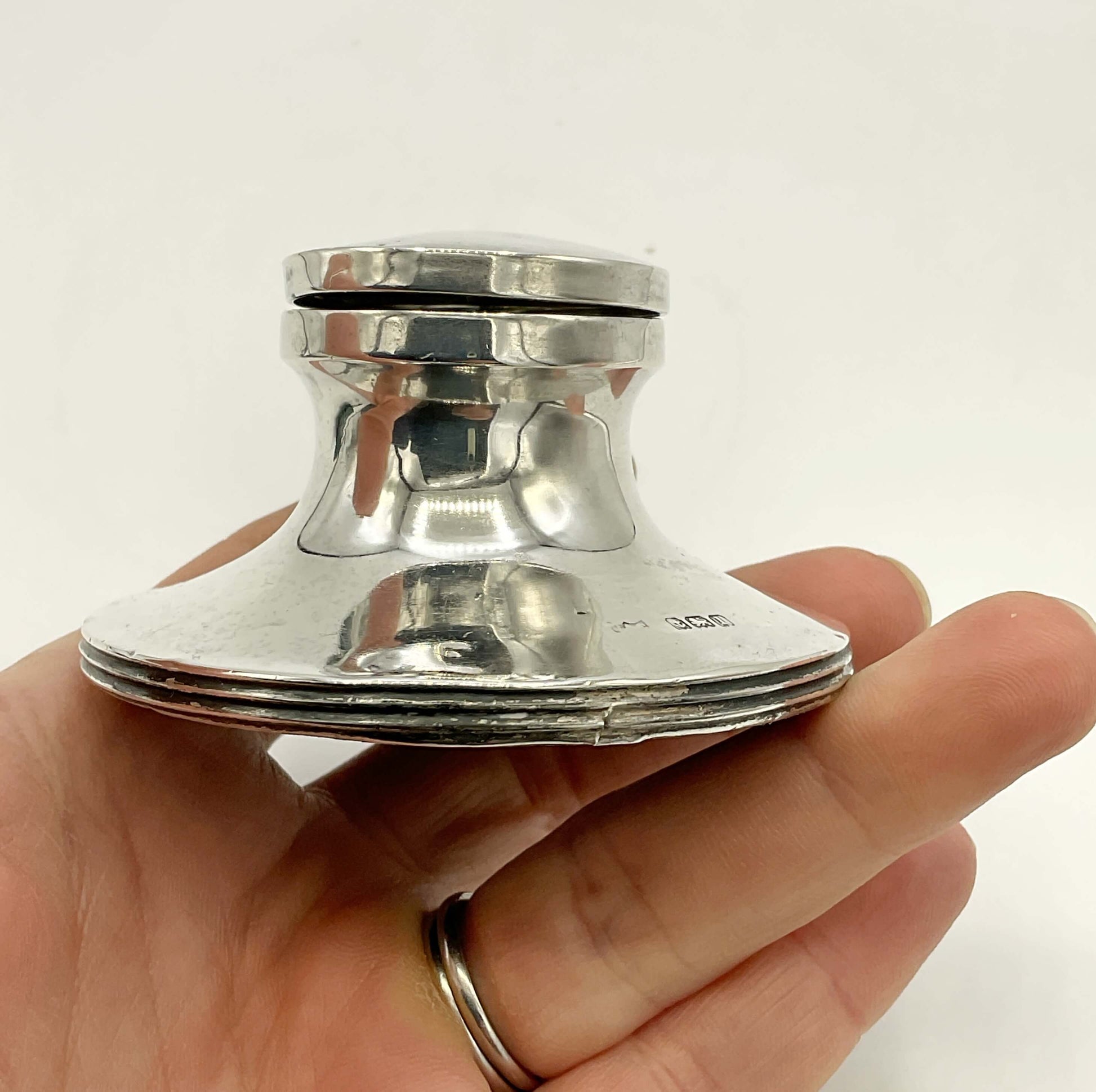 Antique small sterling silver inkwell with detailed engravings, crafted by Beeches Vintage, featuring a vintage lid and classic design.
