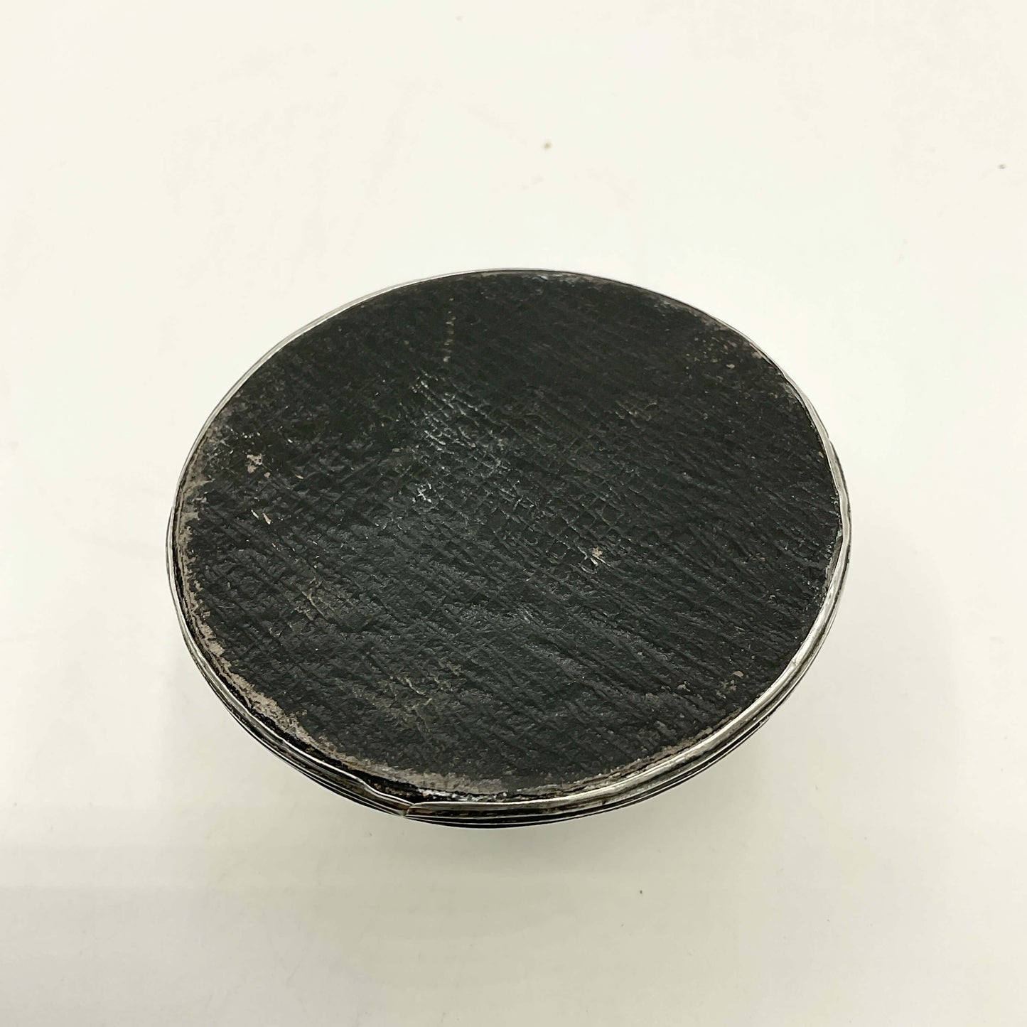 Antique small sterling silver inkwell with detailed design, crafted by Beeches Vintage, displayed on a wooden surface.