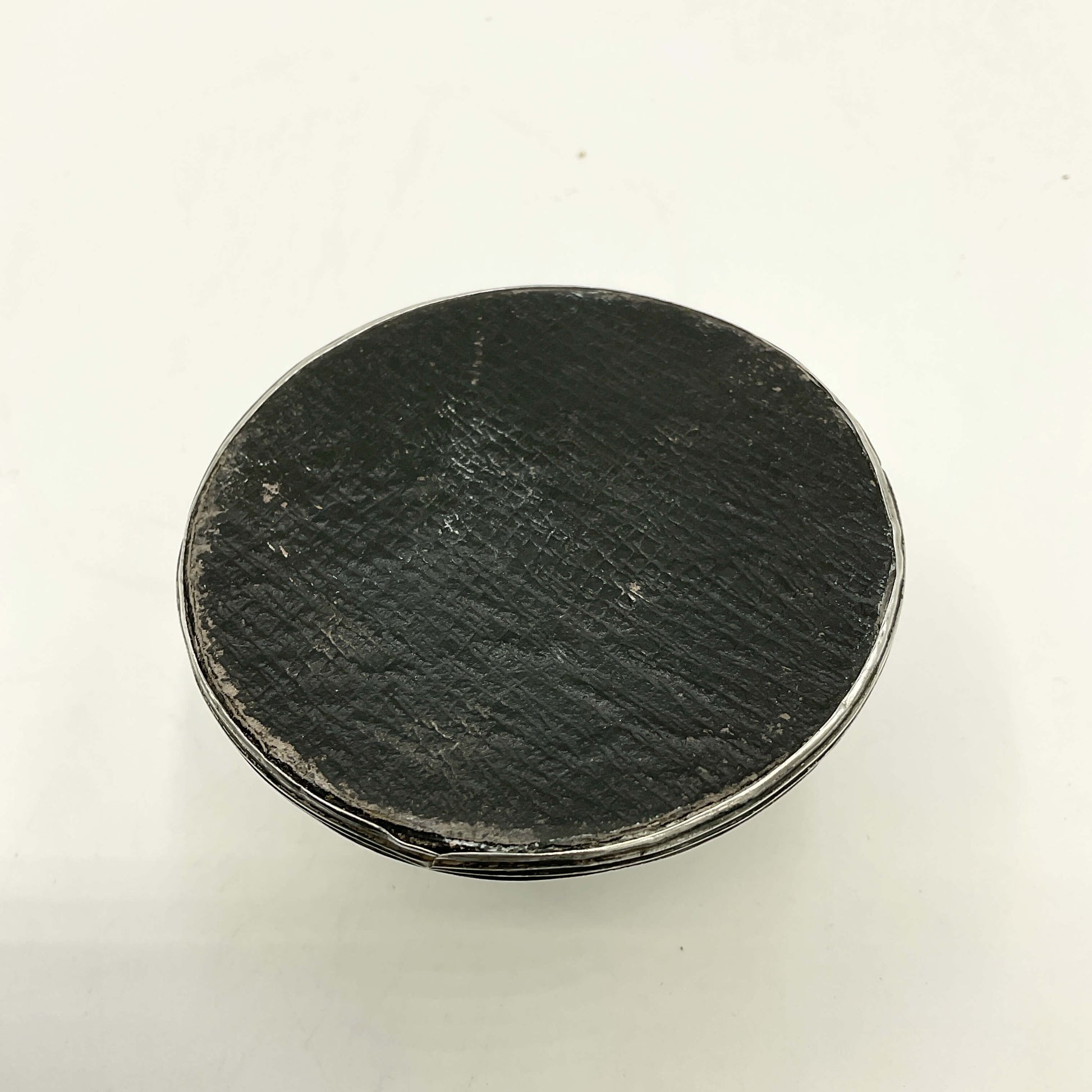 Antique small sterling silver inkwell with detailed design, crafted by Beeches Vintage, displayed on a wooden surface.