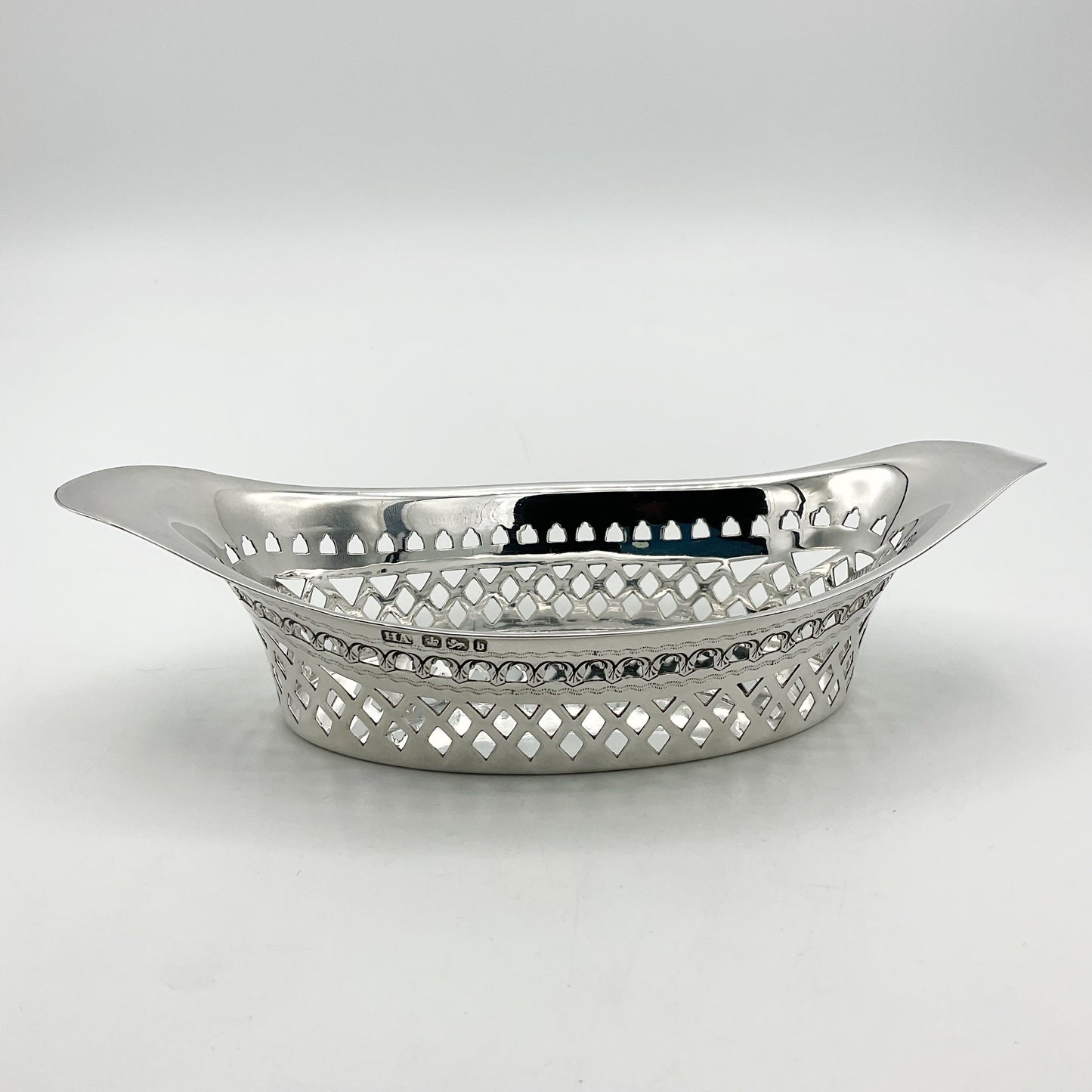 Antique Silver pierced bowl with hallmarks on white background 