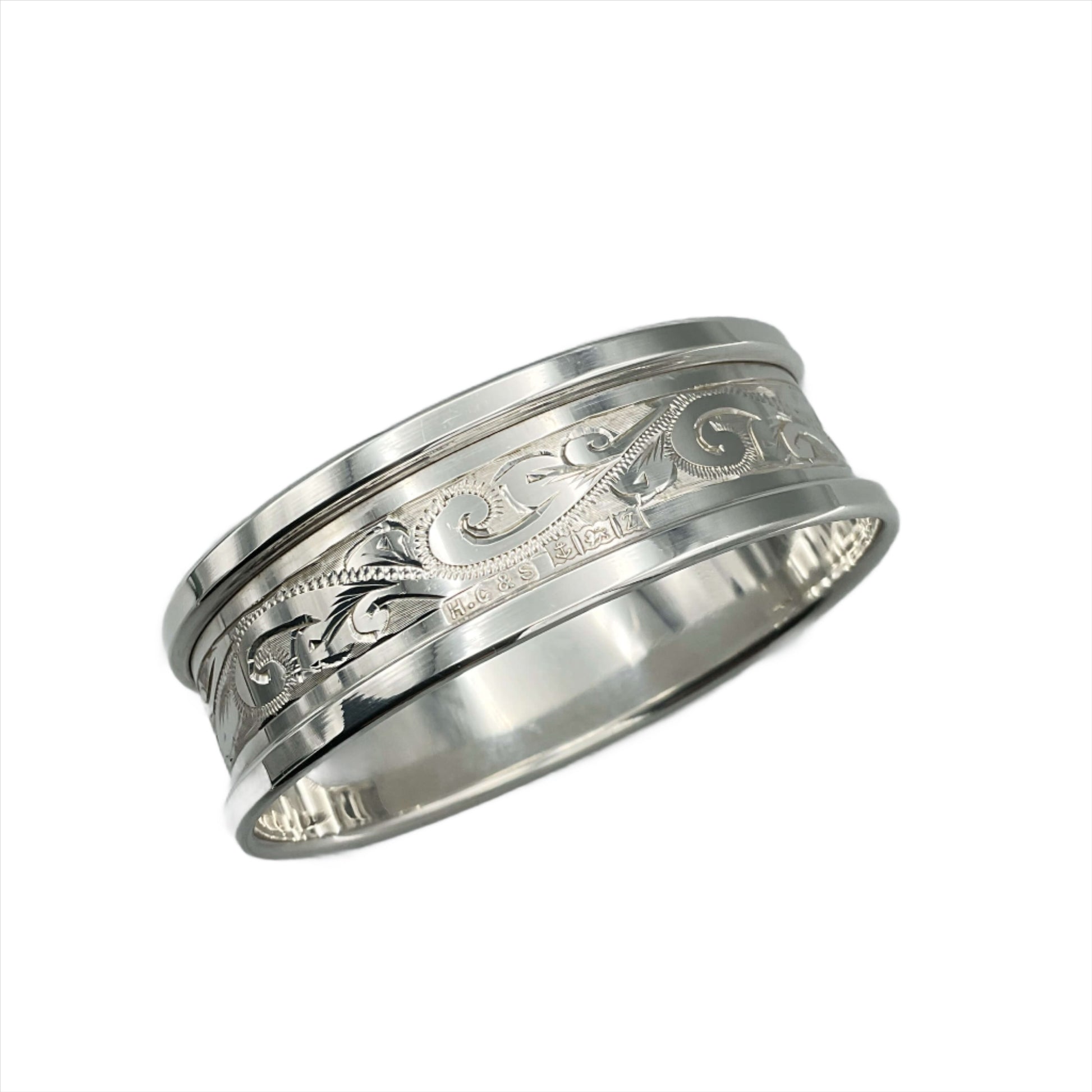 Back of Silver napkin ring with blank rectangular cartouche and etched flower pattern showing hallmarks and maker's marks