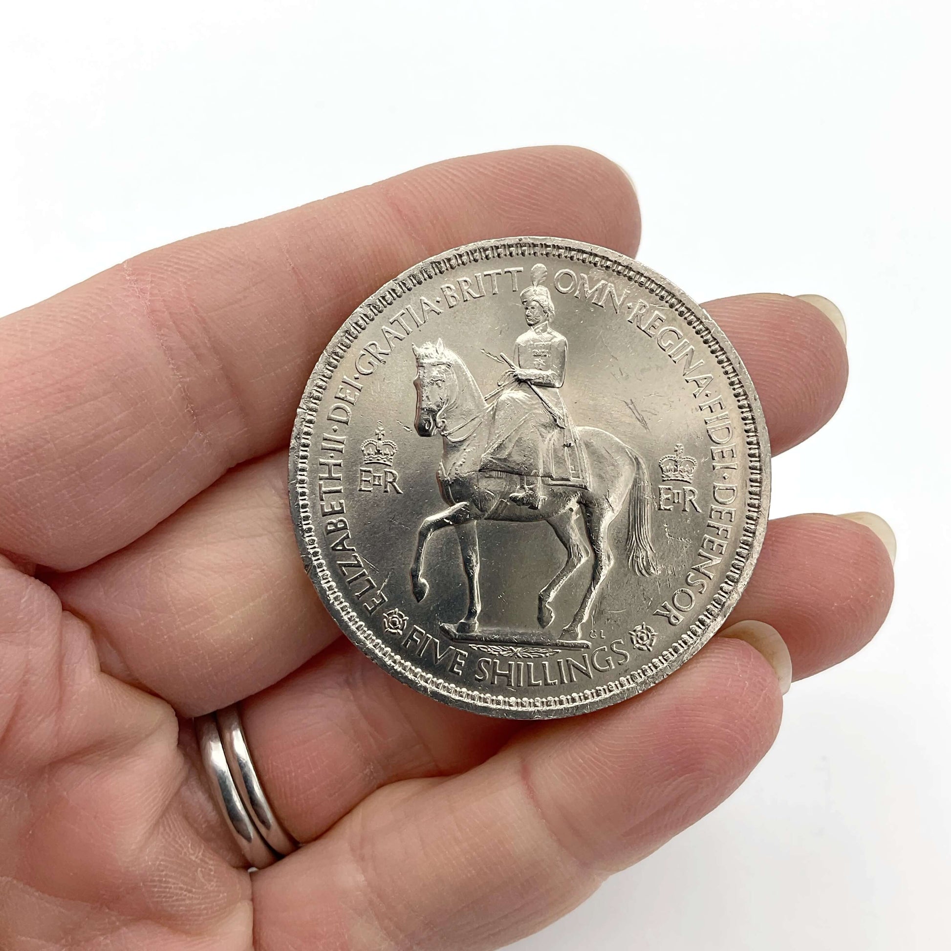 Reverse of 1953 Queen Elizabeth II Coronation Coin held in hand