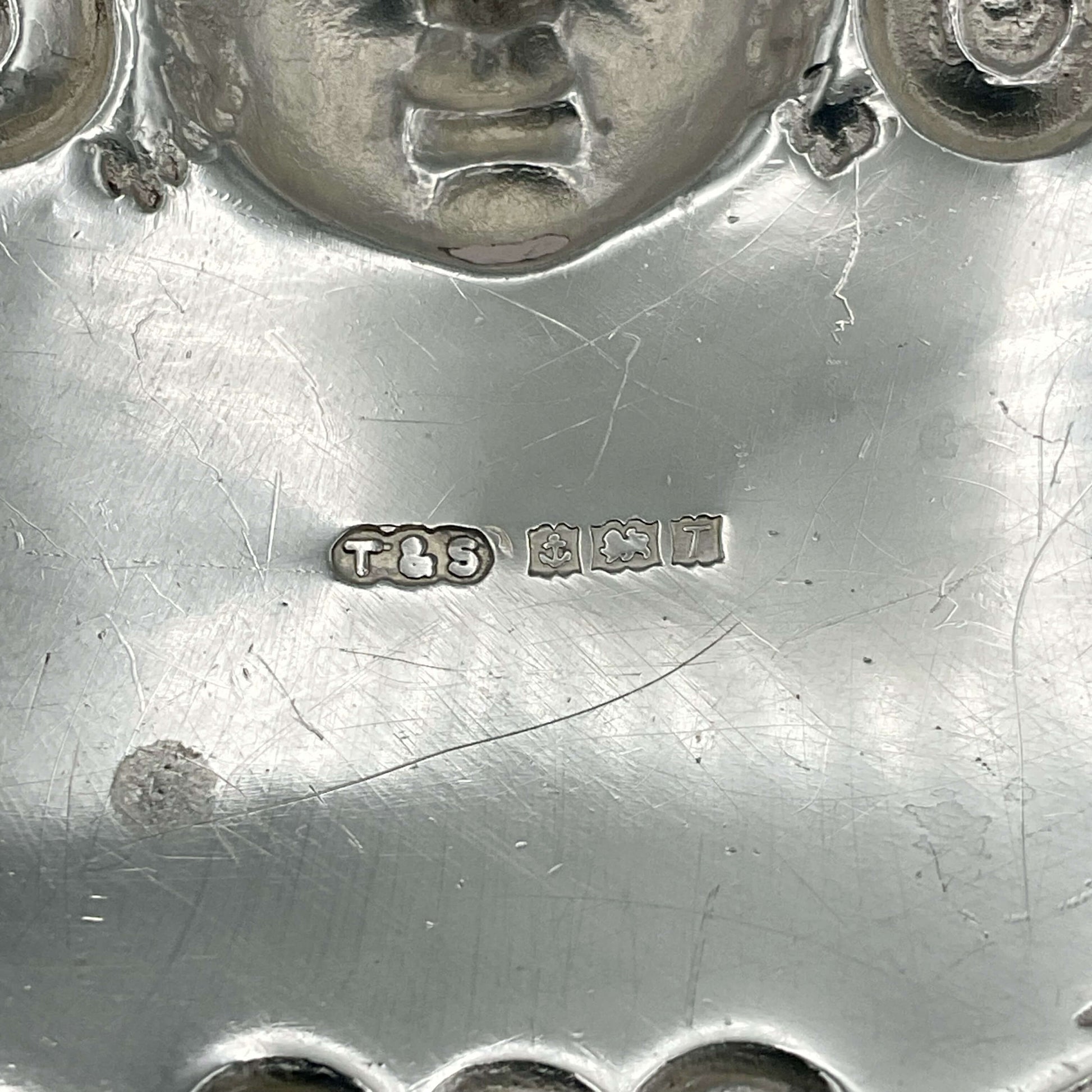 back of whisky decanter label showing the makers mark and hallmarks