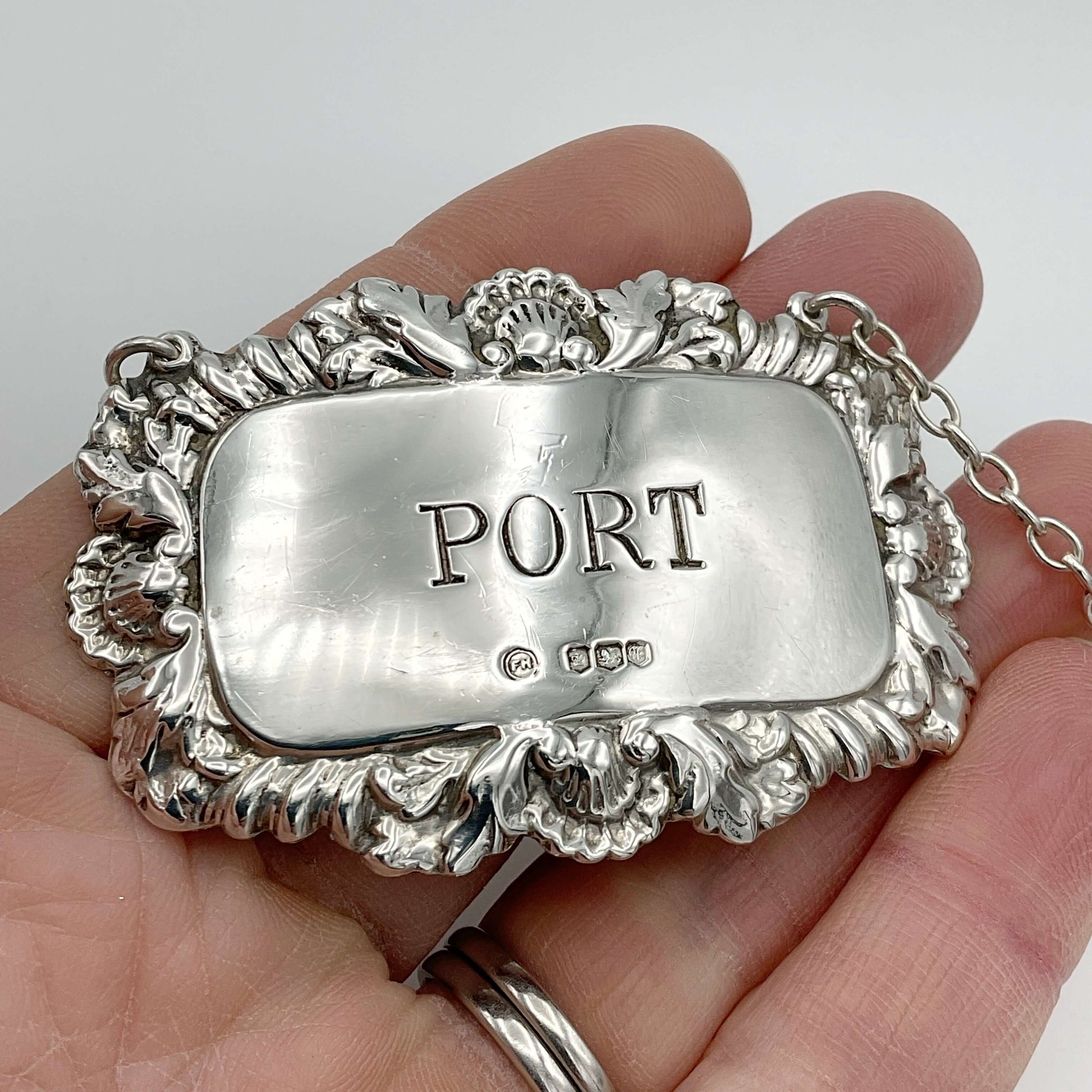 silver Port decanter label held in a hand