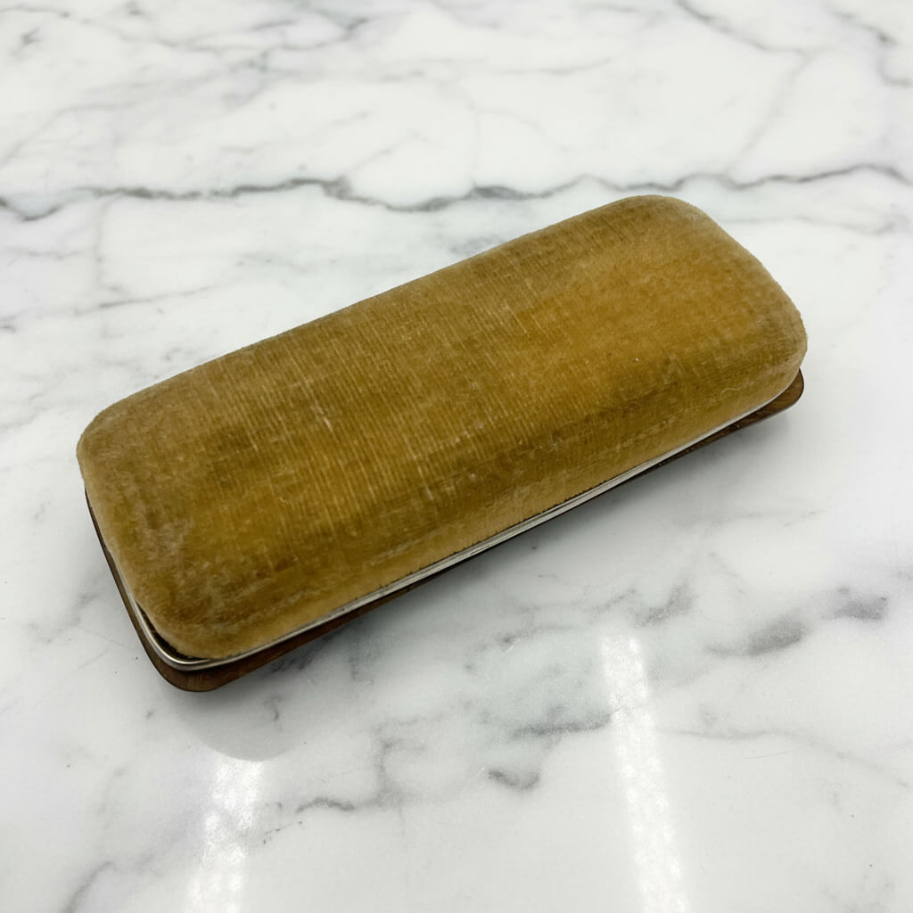 beige velvet shoe buffer on a white background on a marble background