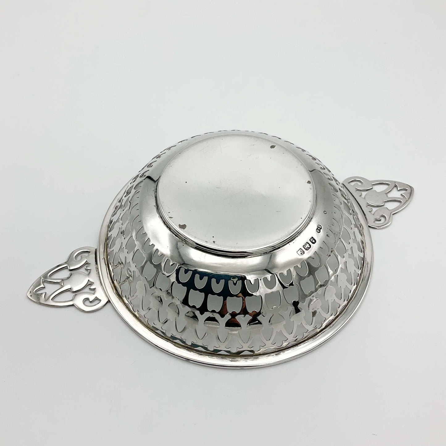 Base of silver bowl with handles showing hallmarks