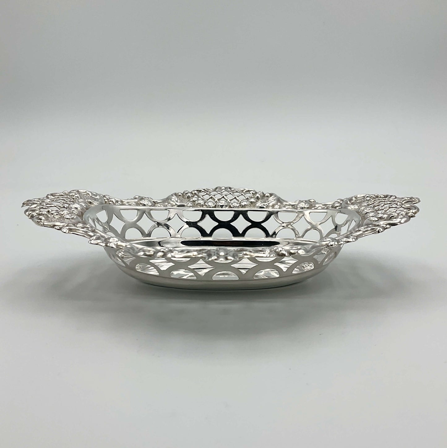 Side view of beautiful pierced silver bowl