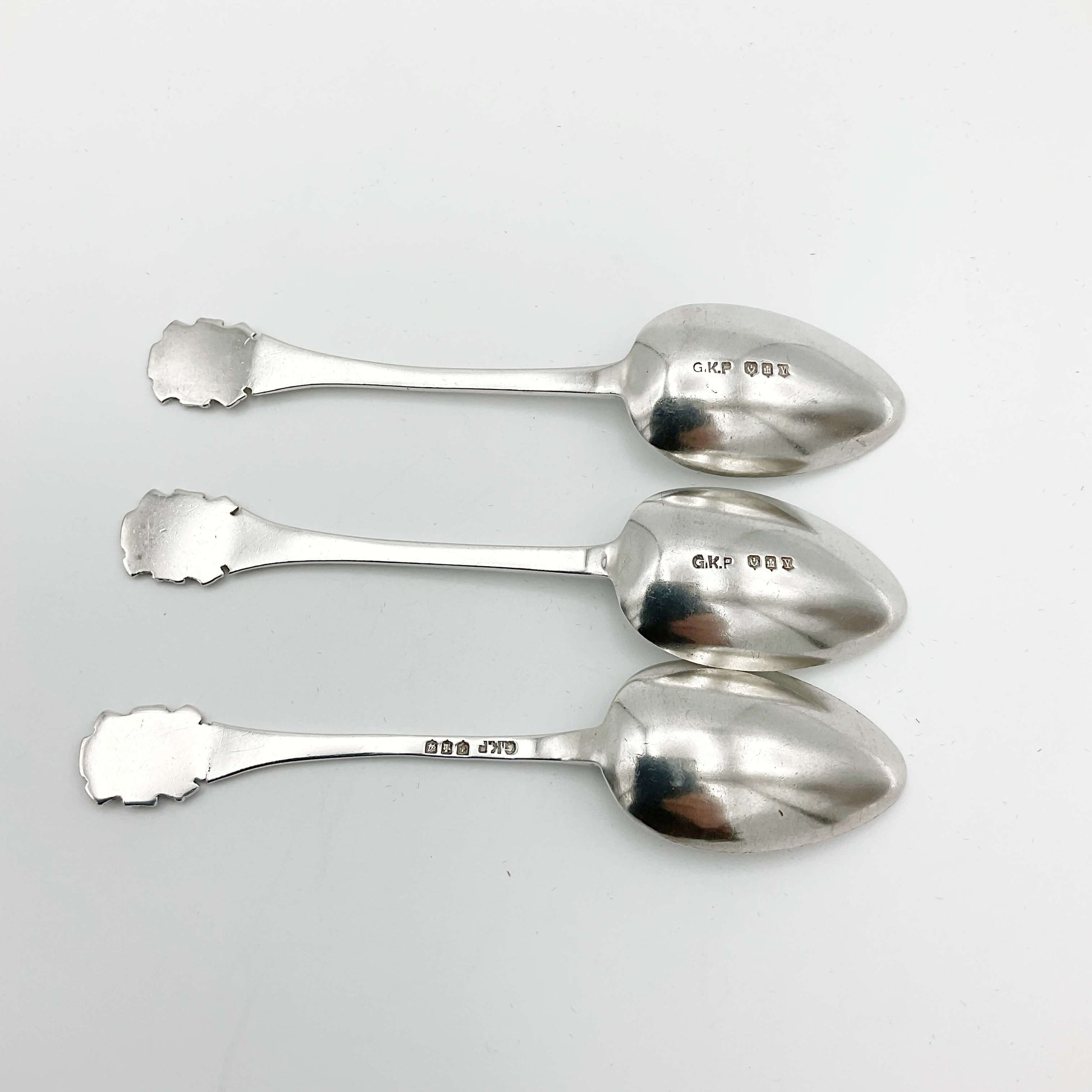 1930s silver coffee spoons showing the hallmarks on their backs