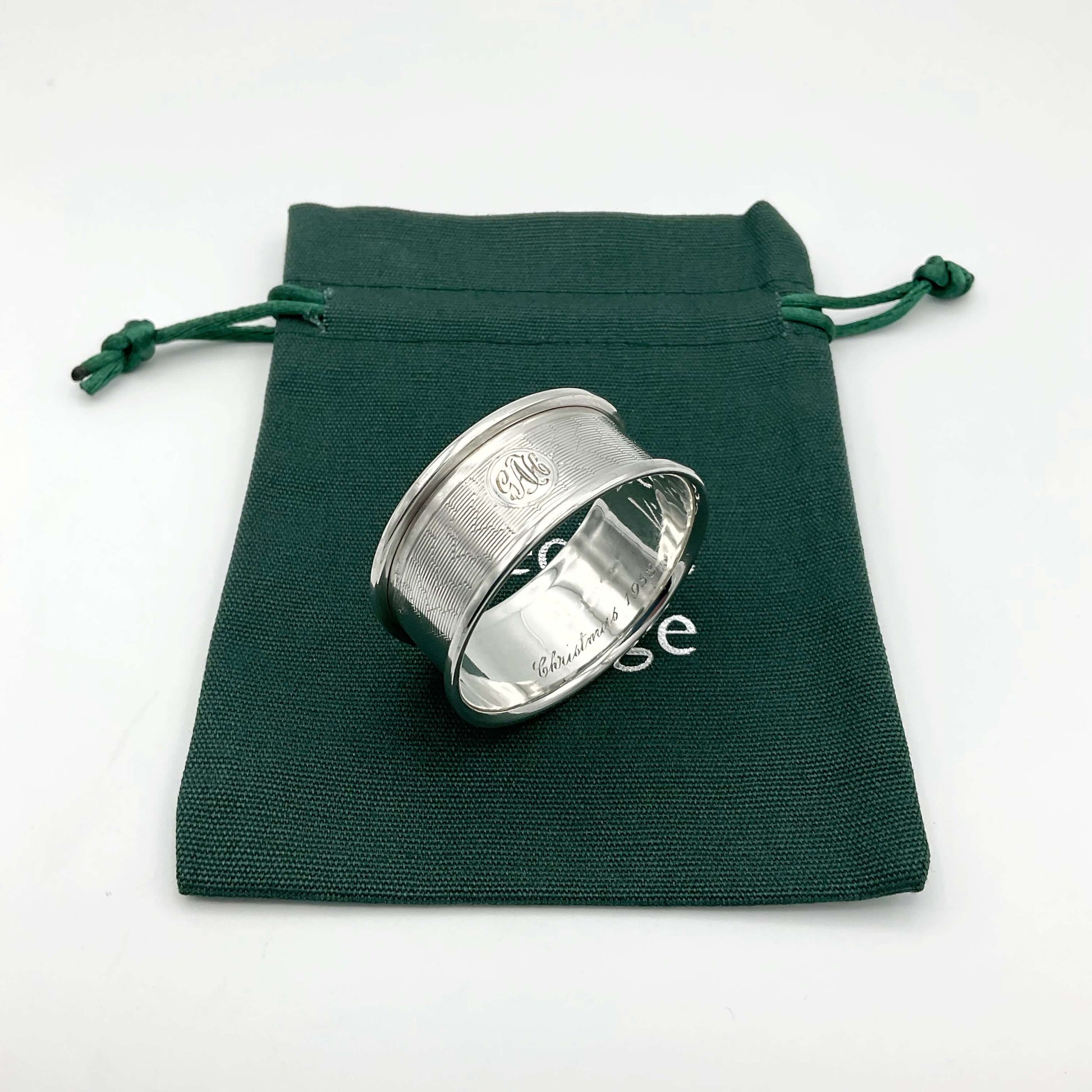 Silver napkin ring on a green gift bag