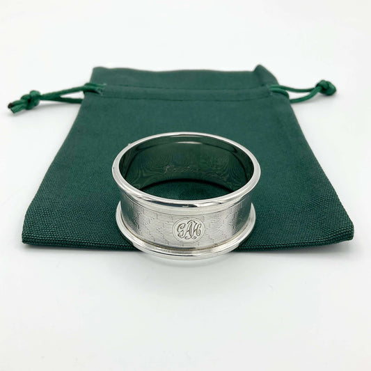 Silver napkin ring on a green gift bag