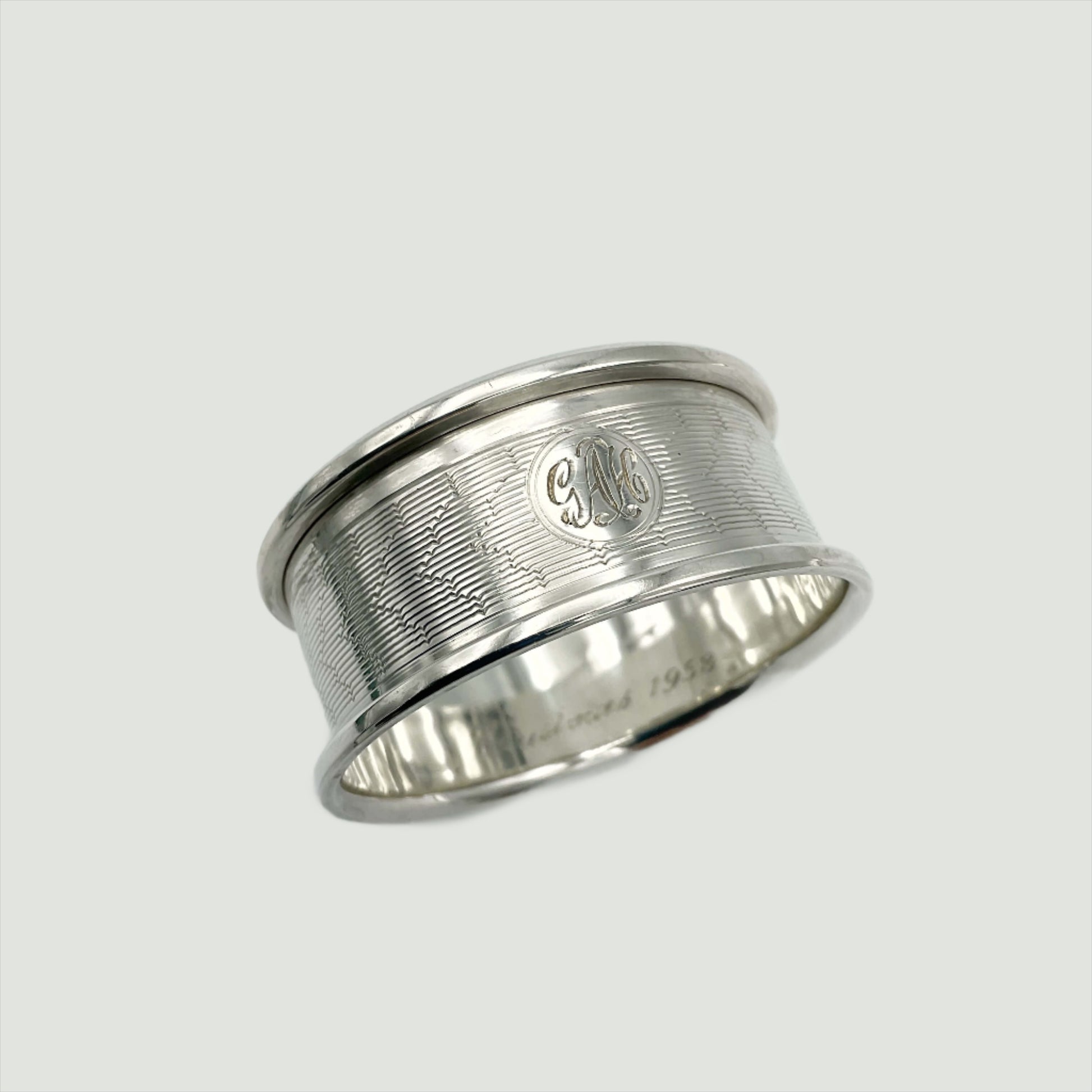 Silver napkin ring on a plain background 