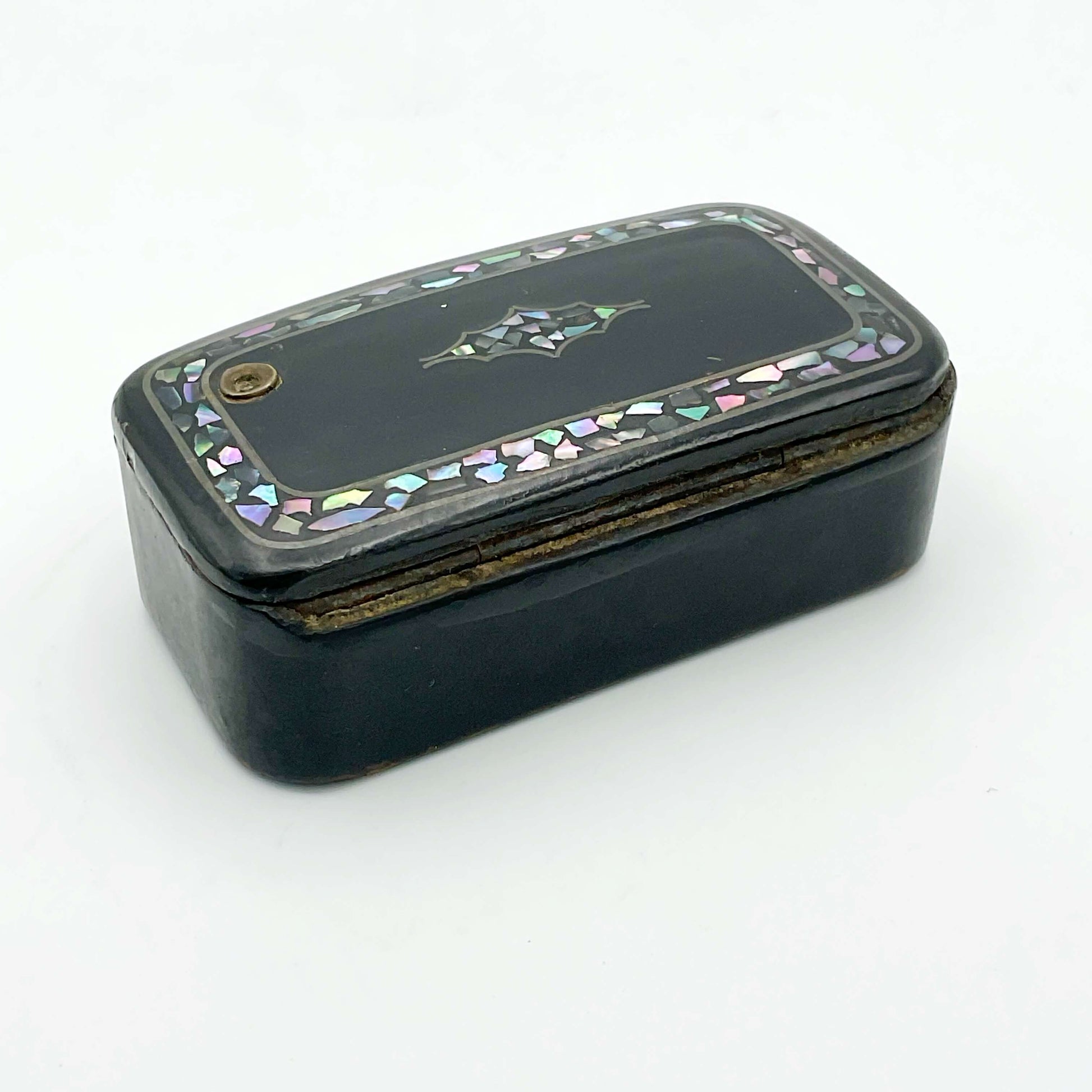 Back view of Antique black lacquer snuff box with multicoloured shell inlay showing a hinge