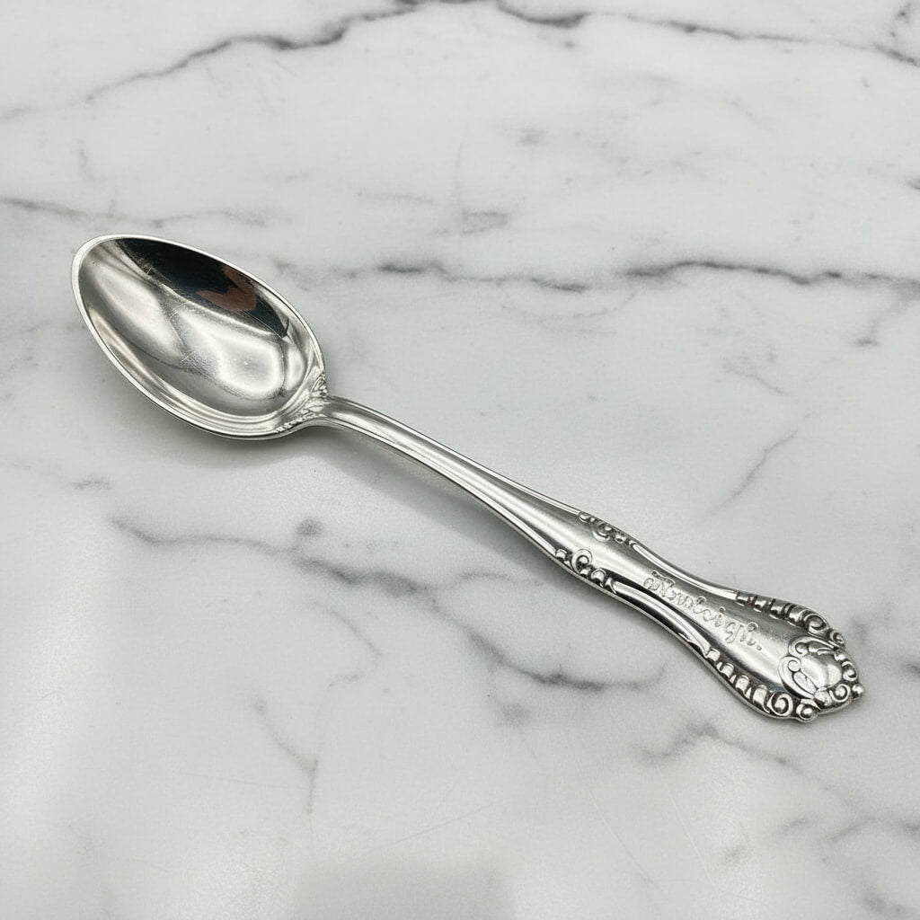 Silver plated spoon with Raleigh on the handle on a marble worktop