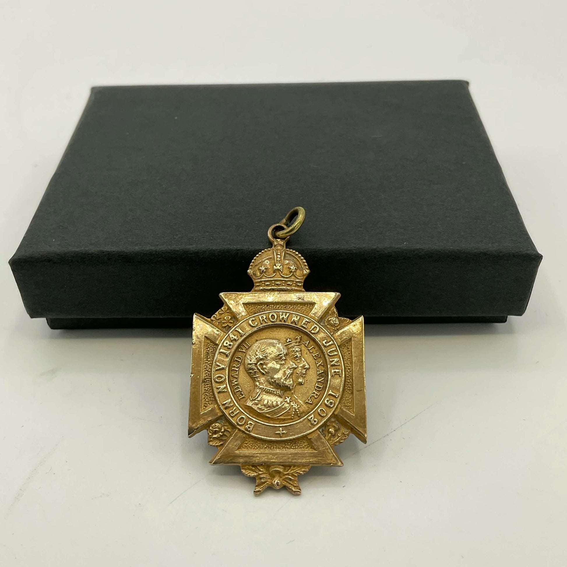 Brass 1902 coronation medal on black box