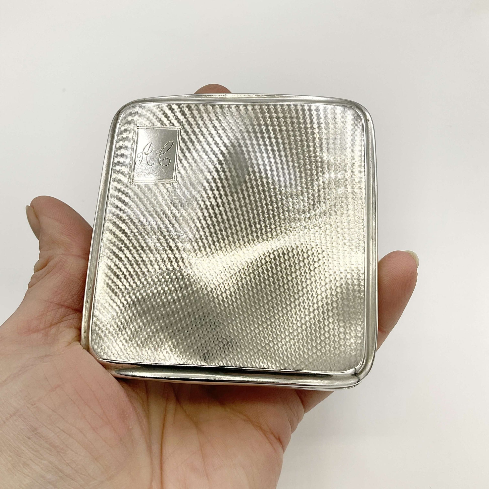 Silver Cigarette Case in a hand