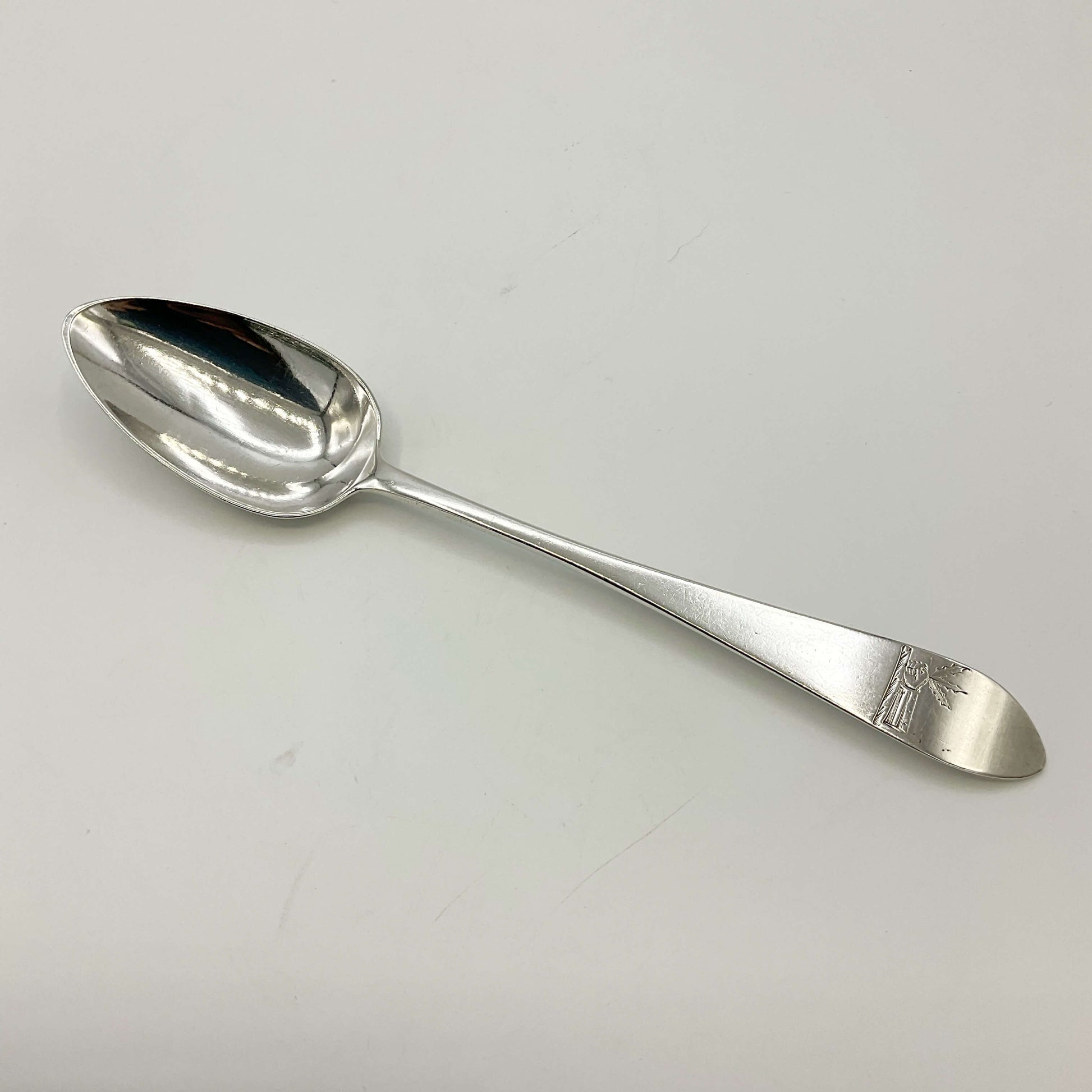 Antique Silver Dessert Spoon on a white background 