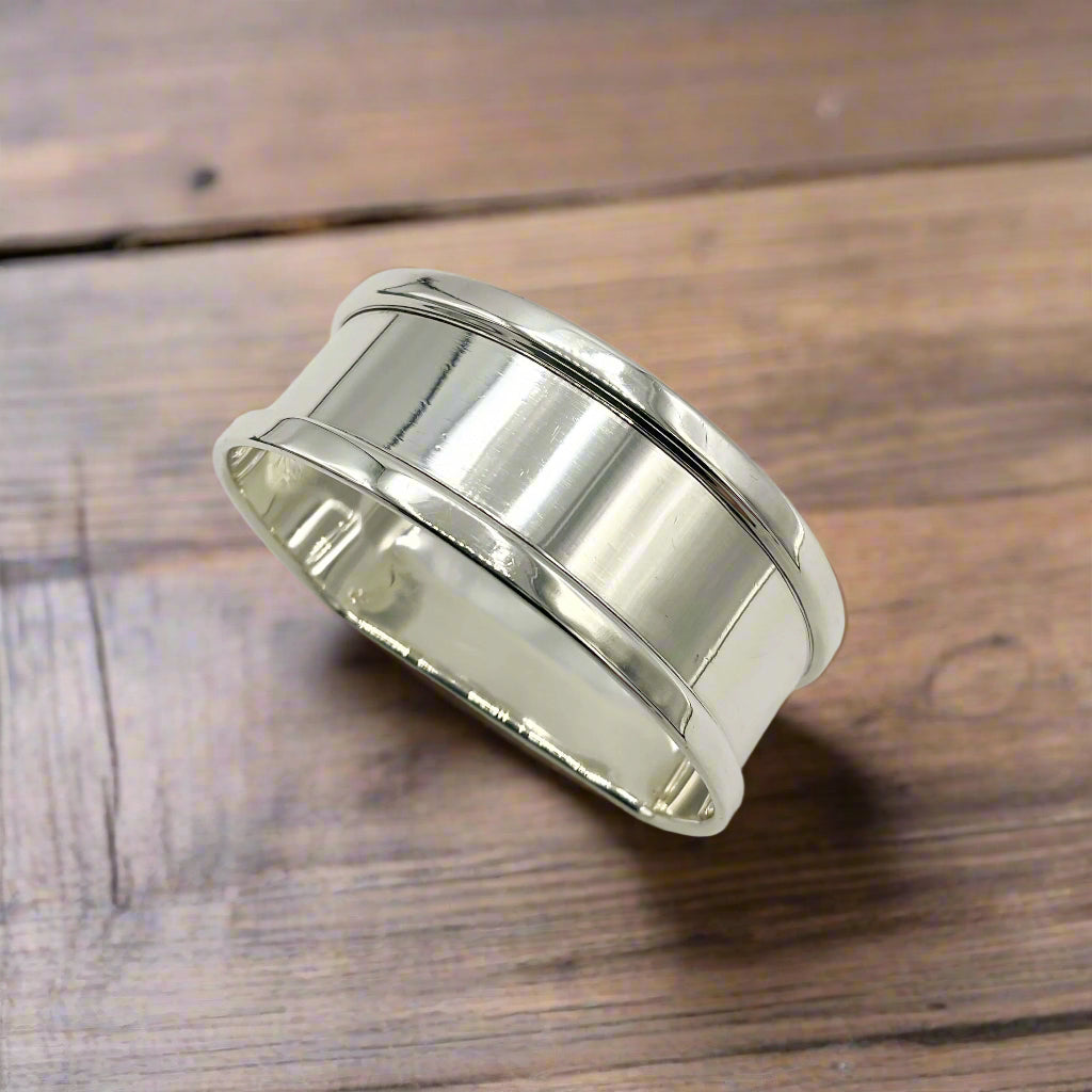 Vintage silver napkin ring on a wooden table 