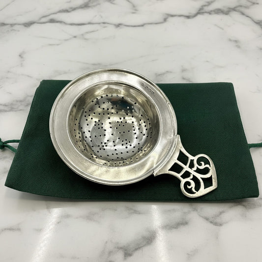Antique 1925 Sterling Silver Beeches Vintage tea strainer with intricate woven mesh and ornate handle.