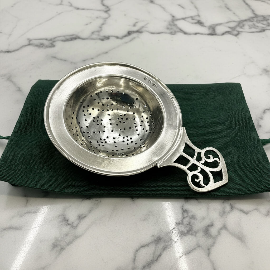Antique 1925 sterling silver tea strainer with ornate design, vintage style, and detailed craftsmanship from Beeches Vintage.