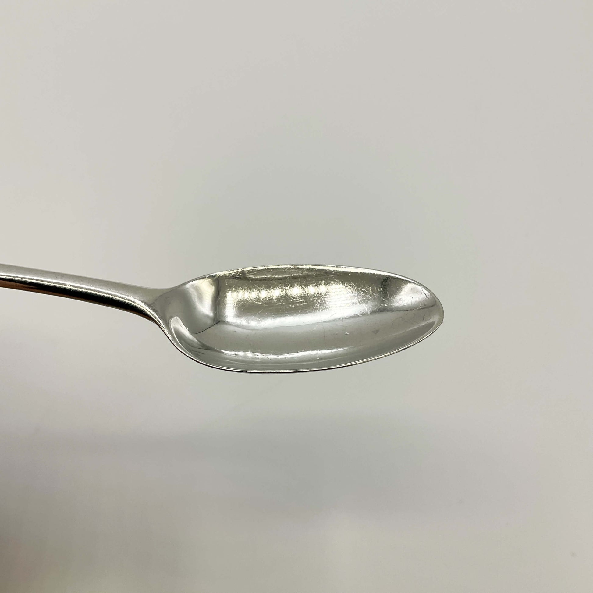 Bowl of Antique silver coffee spoon on a white background 