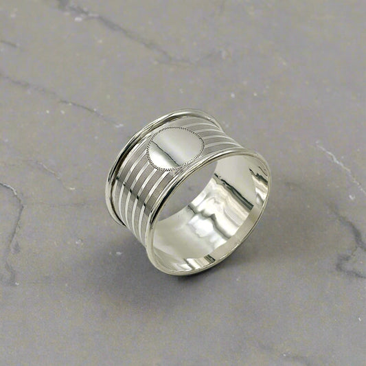 Silver napkin ring on a grey granite worktop