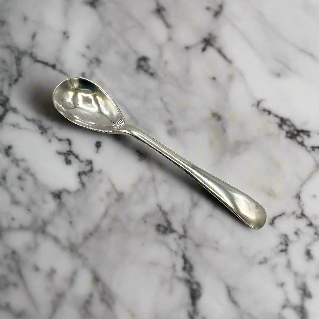 Silver spoon on a marble worktop