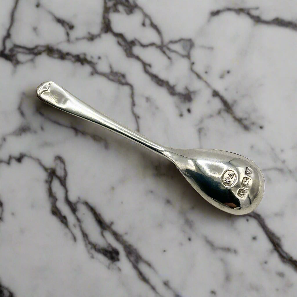 Silver spoon on a marble worktop